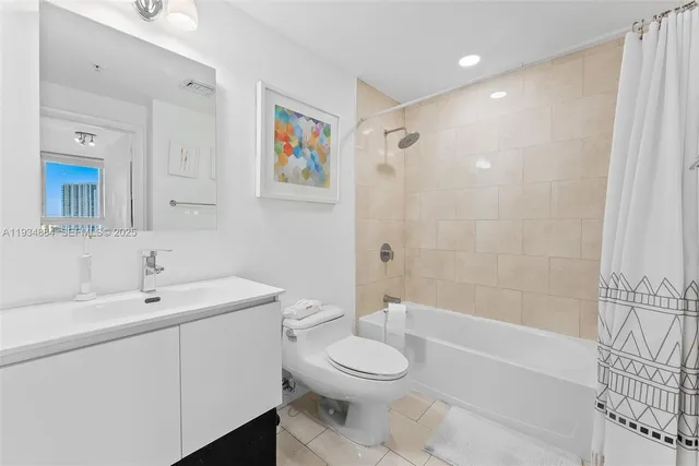 a bathroom with a toilet a sink and bathtub