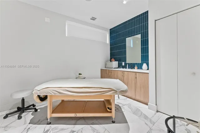 a room with a sink and a mirror