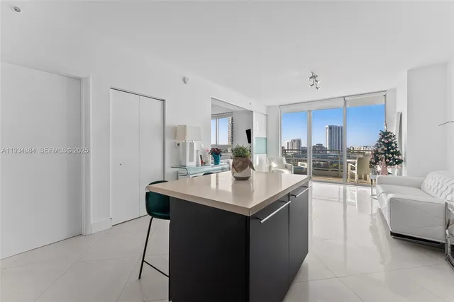 a kitchen with sink cabinets and window