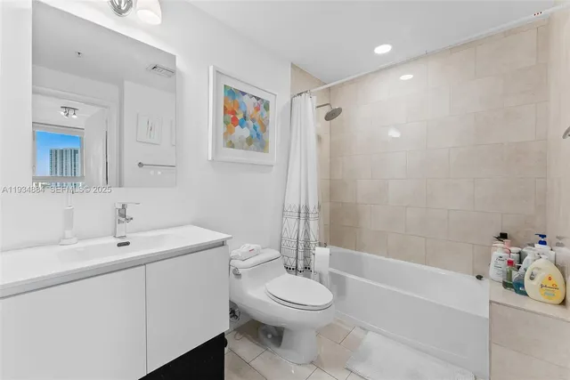 a bathroom with a toilet a sink and a bathtub