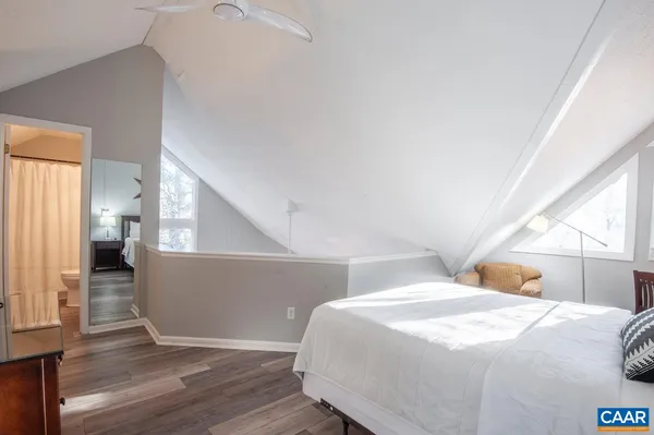 a bathroom with a sink a toilet and shower curtain