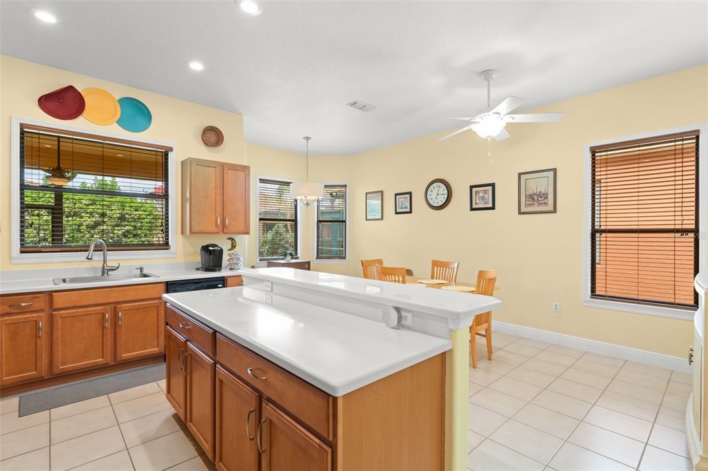 724 Villa Park Road Poinciana, FL 34759 - Photo 12 of 62 a kitchen with a sink and a stove top oven