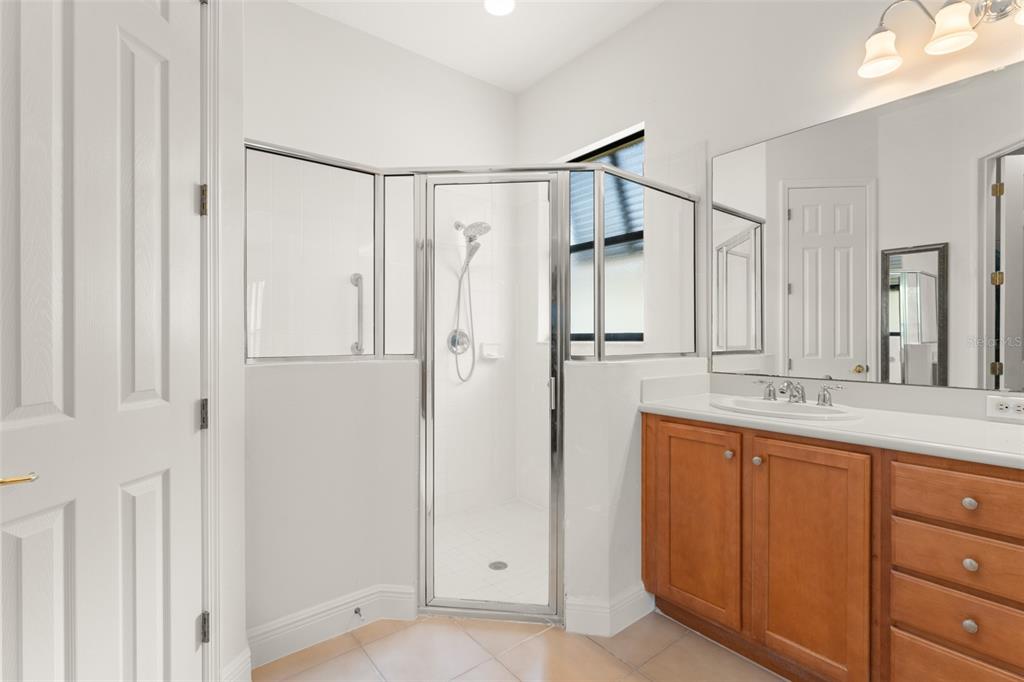724 Villa Park Road Poinciana, FL 34759 - Photo 22 of 62 a bathroom with a shower sink and mirror