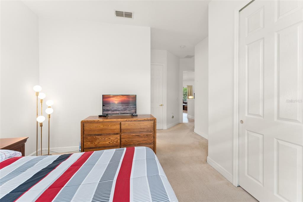724 Villa Park Road Poinciana, FL 34759 - Photo 25 of 62 a bedroom with a bed and a couch