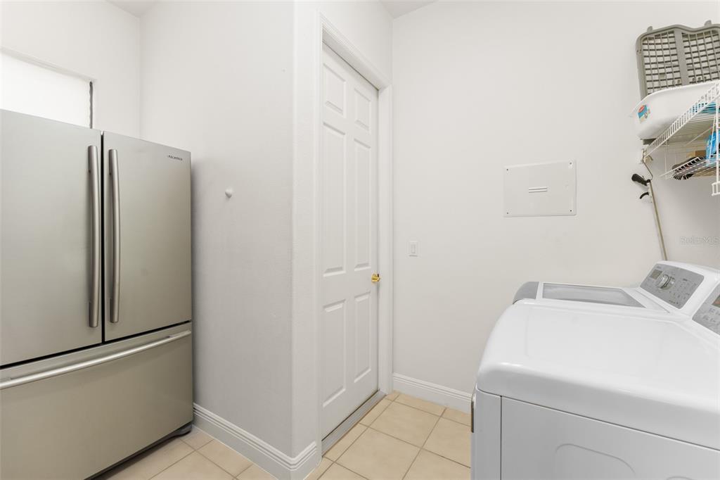 724 Villa Park Road Poinciana, FL 34759 - Photo 27 of 62 a utility room with dryer and washer