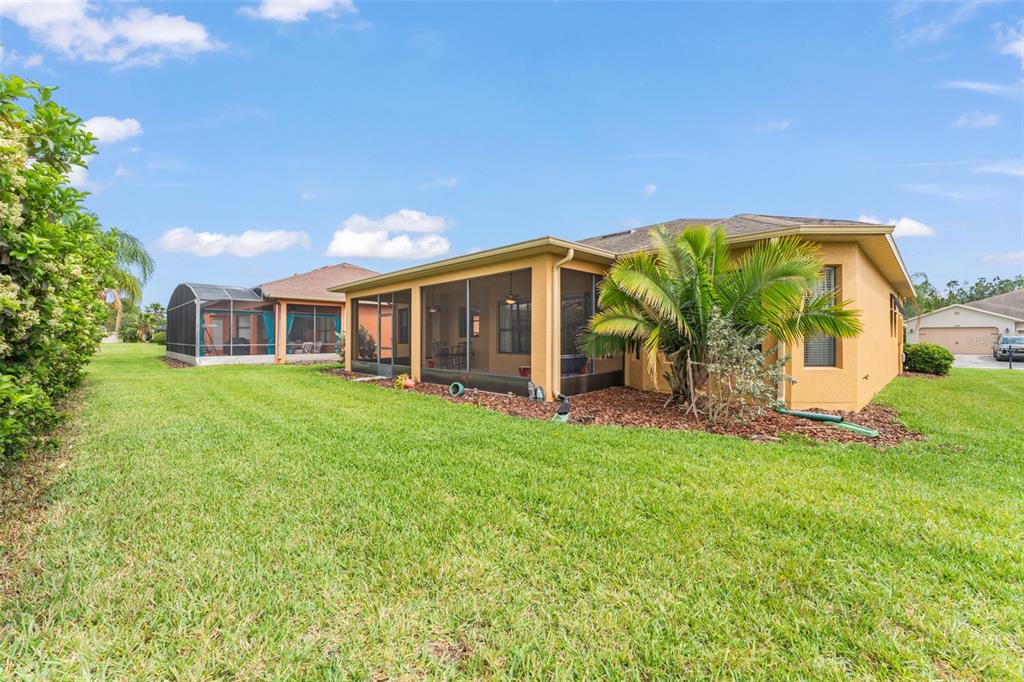 724 Villa Park Road Poinciana, FL 34759 - Photo 30 of 62 a view of a house with a backyard