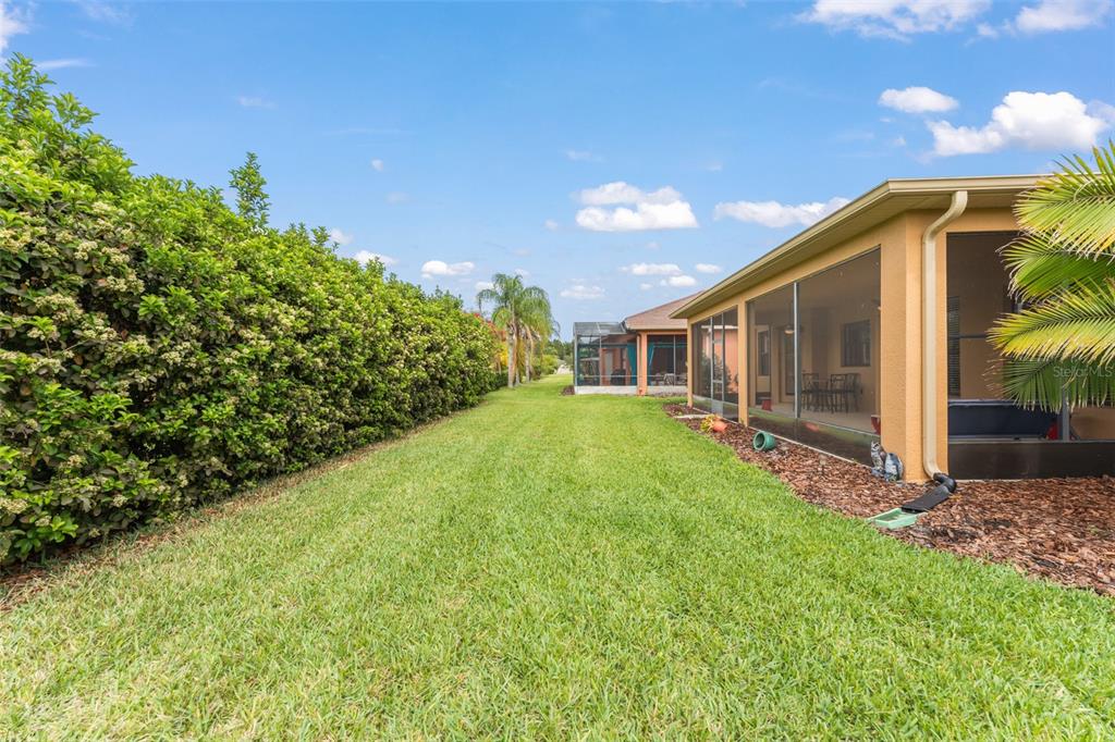 724 Villa Park Road Poinciana, FL 34759 - Photo 31 of 62 a view of a house with backyard and garden