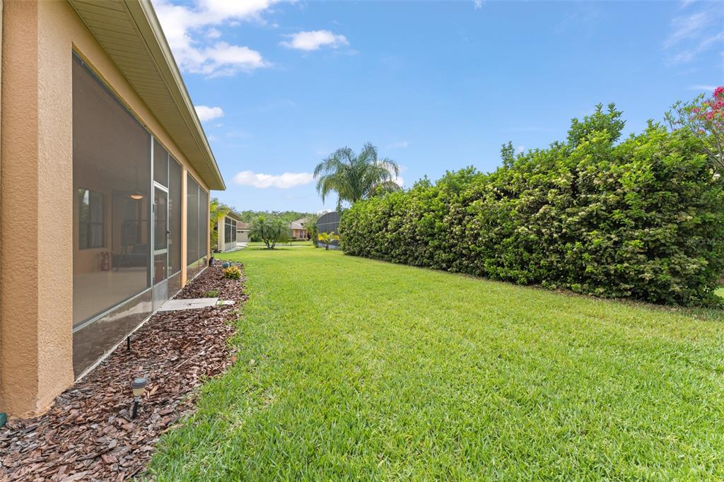 724 Villa Park Road Poinciana, FL 34759 - Photo 32 of 62 a view of a yard with an outdoor space