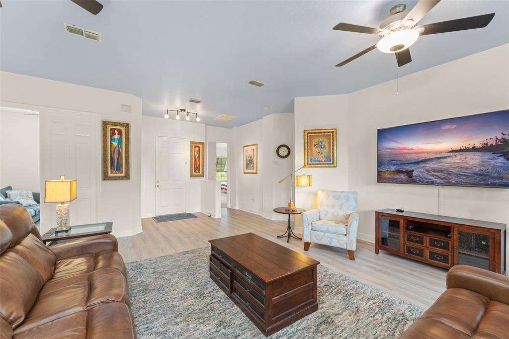 724 Villa Park Road Poinciana, FL 34759 - Photo 5 of 62 a living room with furniture and a flat screen tv