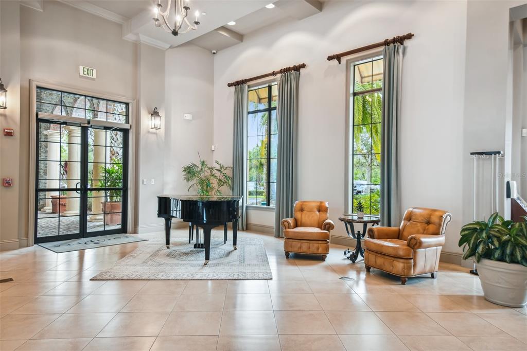 724 Villa Park Road Poinciana, FL 34759 - Photo 61 of 62 a living room with furniture and floor to ceiling windows