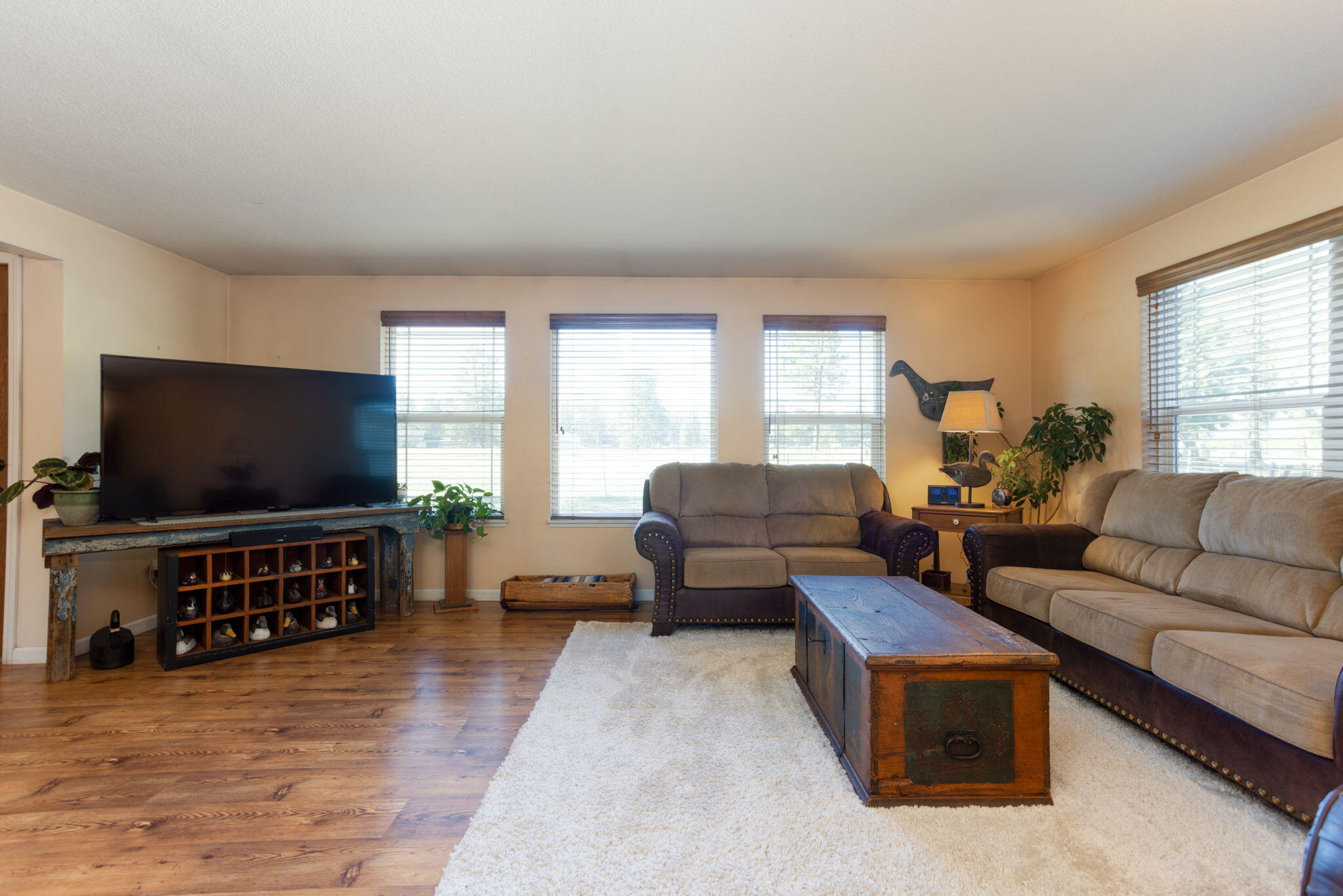 19450 Calico Road Bend, OR 97702 - Photo 8 of 41 a living room with furniture and a flat screen tv