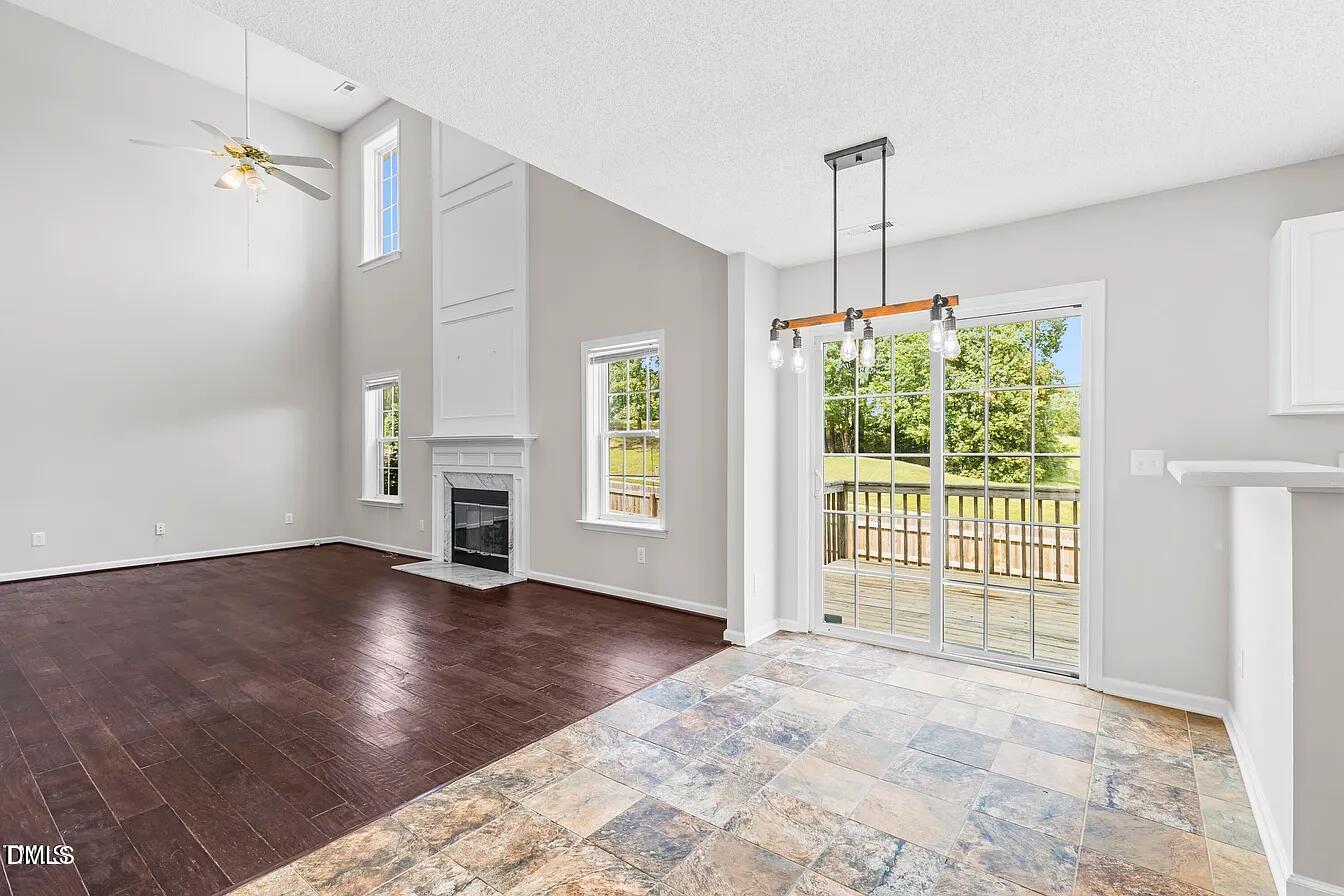 5 Gateview Court Durham, NC 27703 - Photo 11 of 23 an empty room with wooden floor and windows