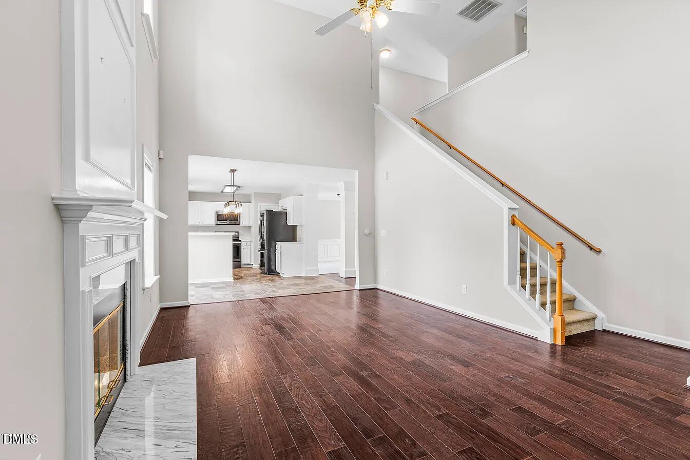 5 Gateview Court Durham, NC 27703 - Photo 12 of 23 a view of a hallway with wooden floor and staircase
