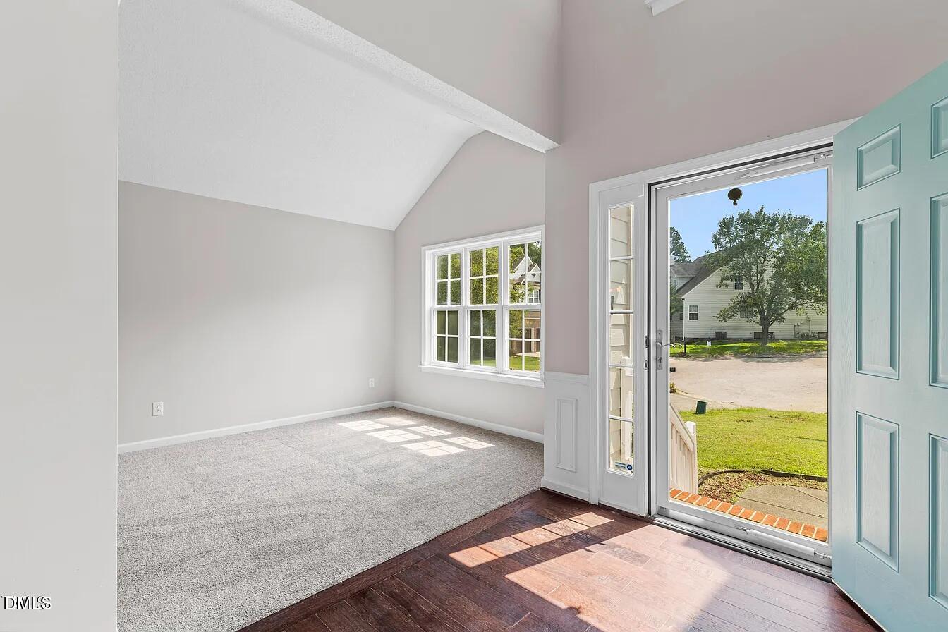 5 Gateview Court Durham, NC 27703 - Photo 2 of 23 wooden floor in an empty room with a window