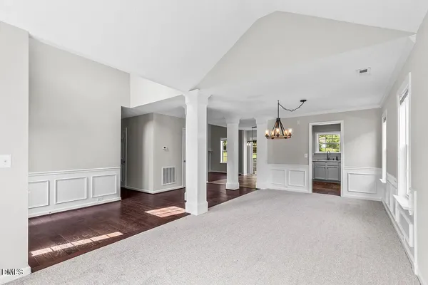 a view of a big room with windows and cabinet