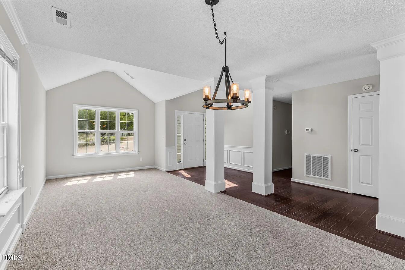 5 Gateview Court Durham, NC 27703 - Photo 4 of 23 a view of a chandelier in big room and windows