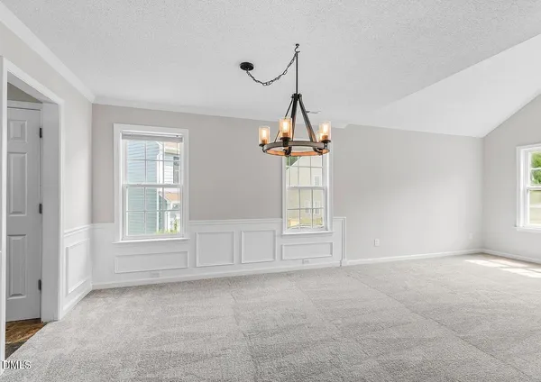 a view of empty room with windows