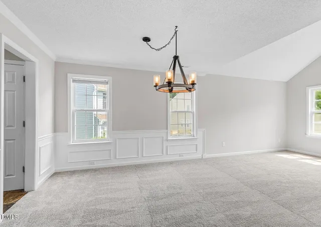 a view of empty room with windows