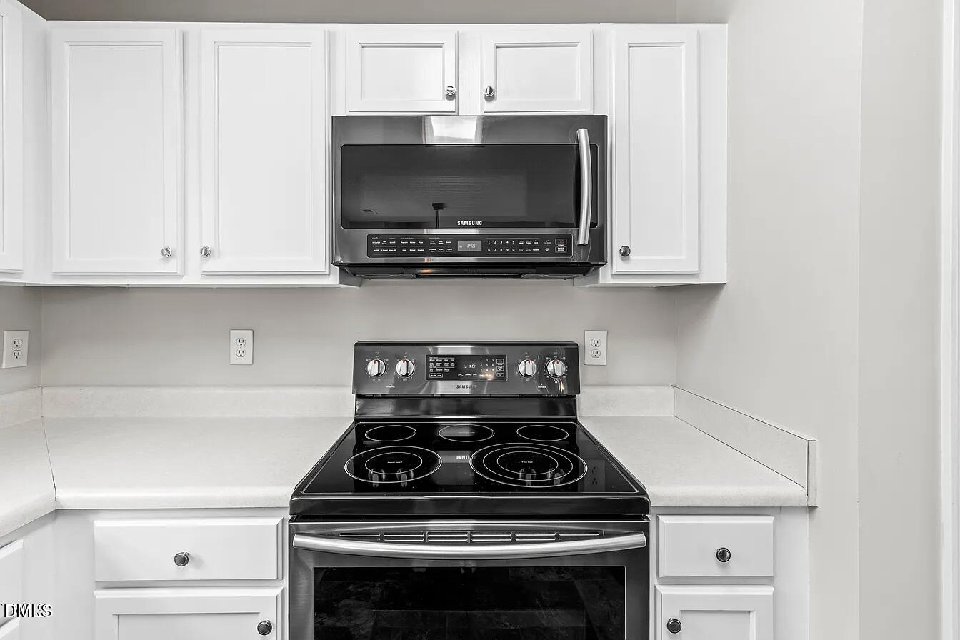 5 Gateview Court Durham, NC 27703 - Photo 9 of 23 a stove top oven sitting inside of a kitchen