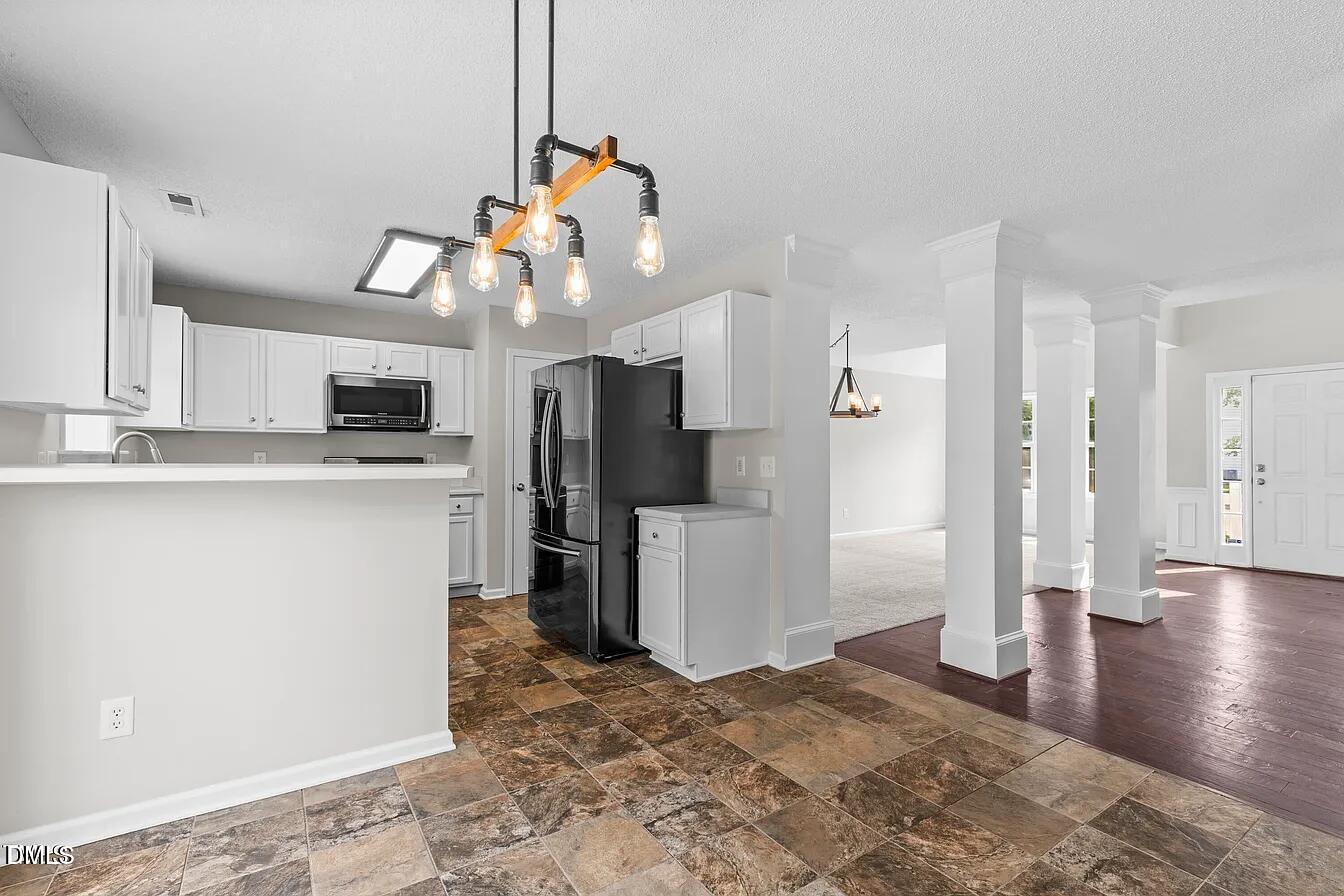 5 Gateview Court Durham, NC 27703 - Photo 10 of 23 a kitchen view of refrigerator and window