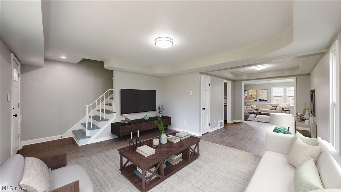 3932 Strandhill Road Cleveland, OH 44128 - Photo 5 of 27 Living room featuring a raised ceiling and hardwood / wood-style flooring