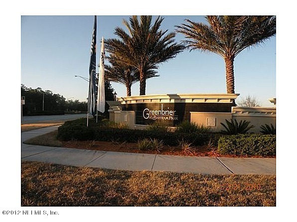 6963 Roundleaf Drive Jacksonville, FL 32258 - Photo 14 of 16 a view of a street with a building