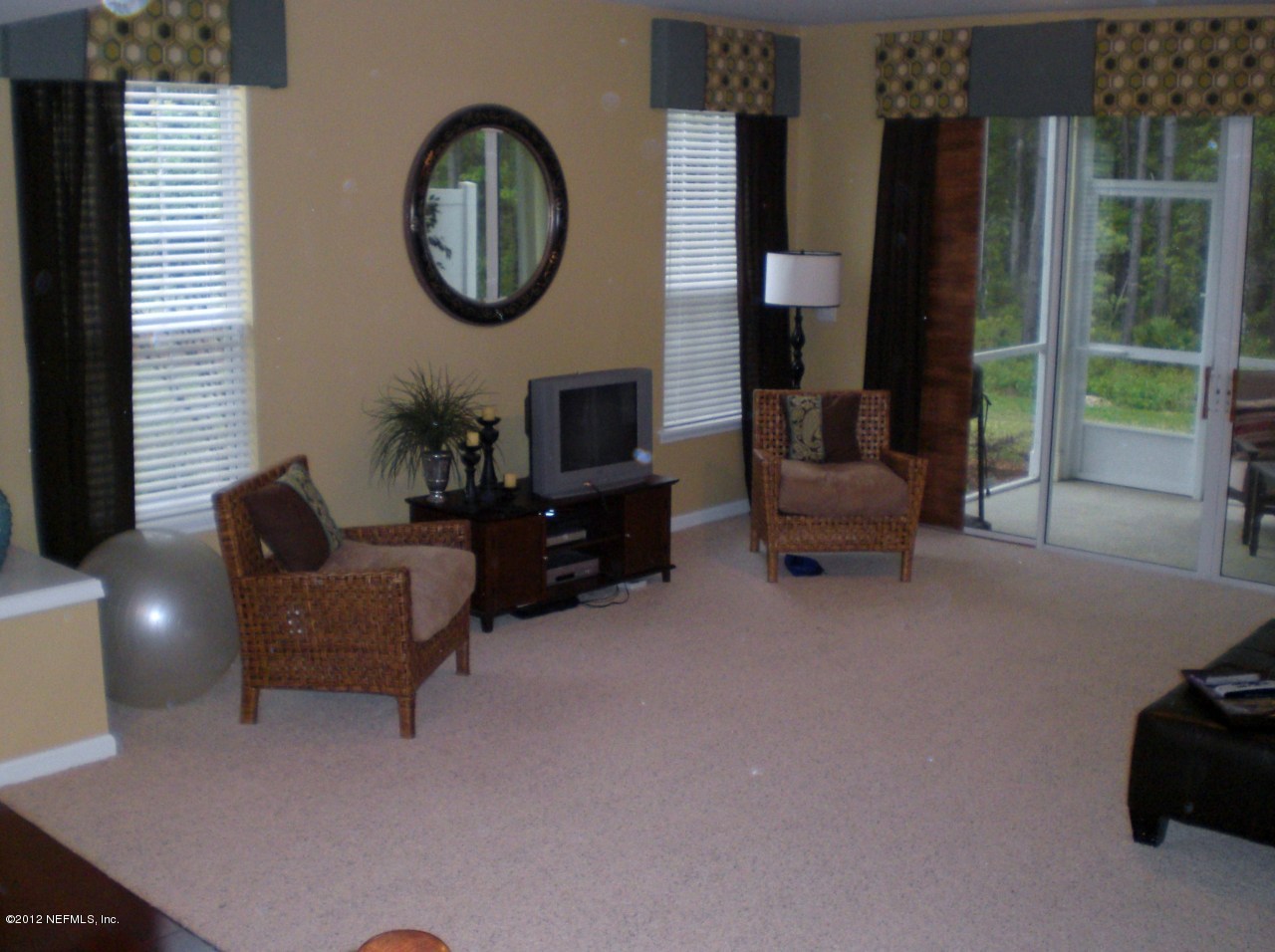 6963 Roundleaf Drive Jacksonville, FL 32258 - Photo 4 of 16 a living room with furniture and a large window