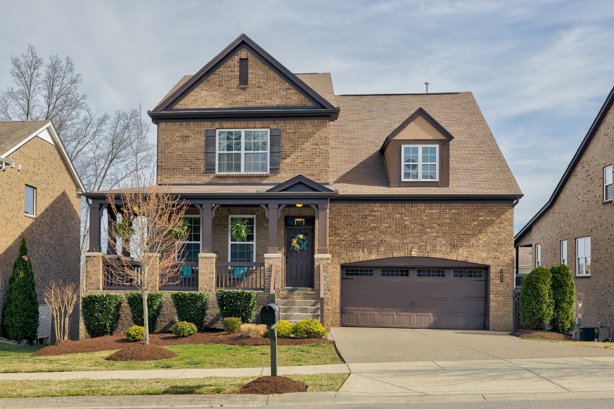 5048 Falling Water Road Nolensville, TN 37135 - Photo 1 of 40 a front view of a house with garden