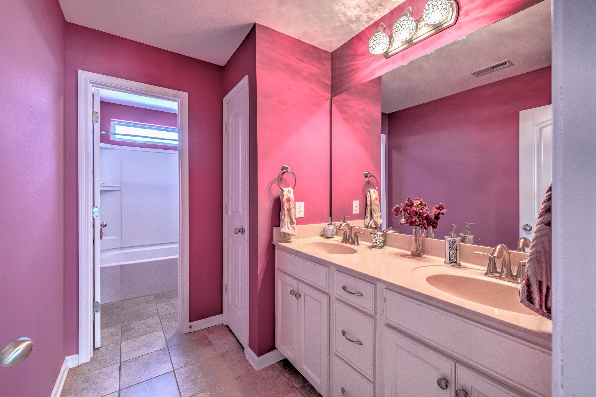 5048 Falling Water Road Nolensville, TN 37135 - Photo 25 of 40 a bathroom with a granite countertop sink a mirror and a bathtub