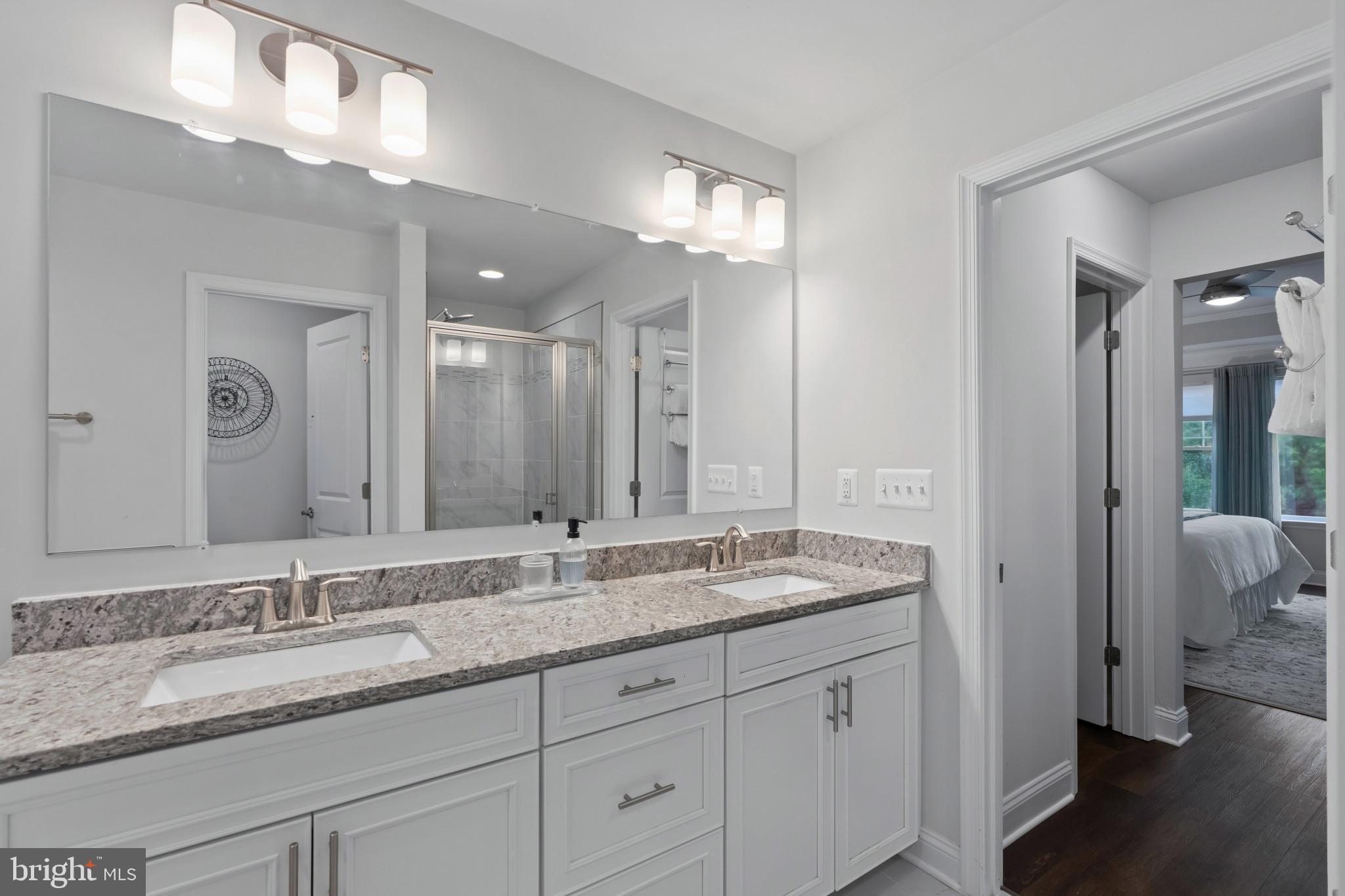 703 Perception Way Aberdeen, MD 21001 - Photo 18 of 42 a bathroom with a granite countertop double vanity sink and a mirror