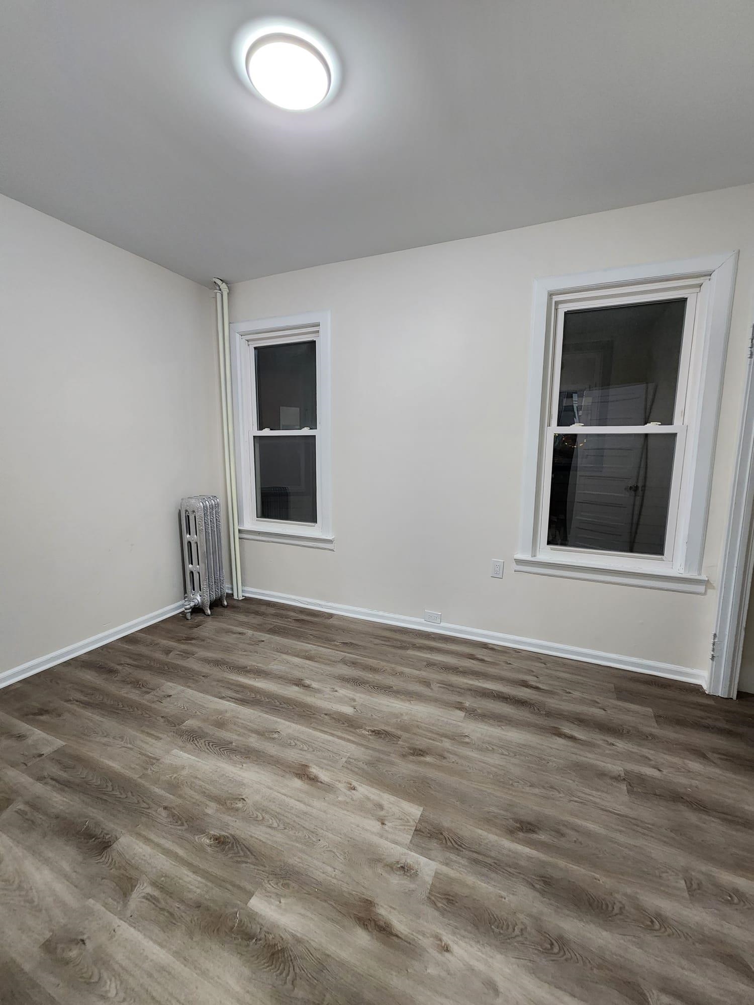 65 Halstead Street, Unit 2 Kearny, NJ 07032 - Photo 12 of 16 a view of an empty room with closet and window