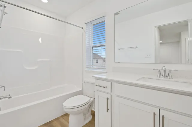 a bathroom with a sink a toilet and a bathtub