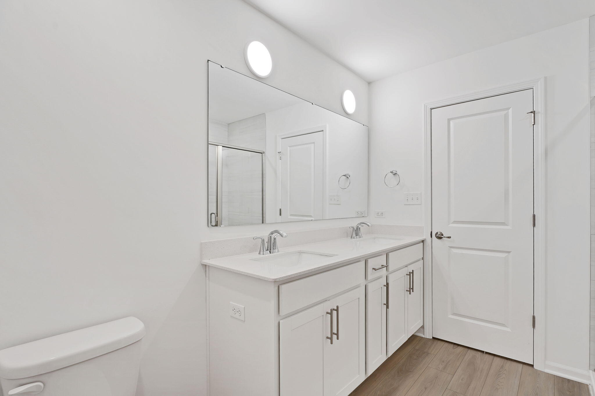 521 East 127th Place Crown Point, IN 46307 - Photo 34 of 37 a view of a bathroom with 2 sink toilet and a mirror