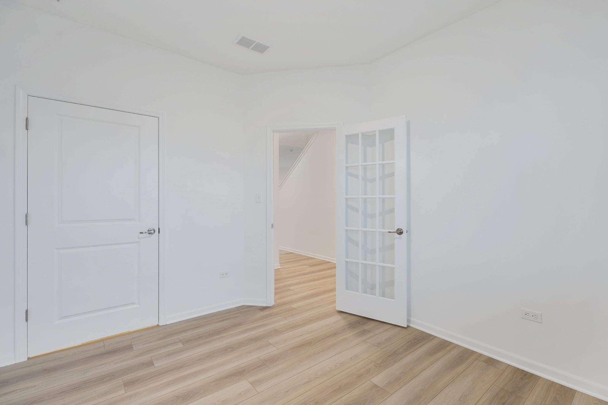 521 East 127th Place Crown Point, IN 46307 - Photo 4 of 37 a view of an empty room with wooden floor