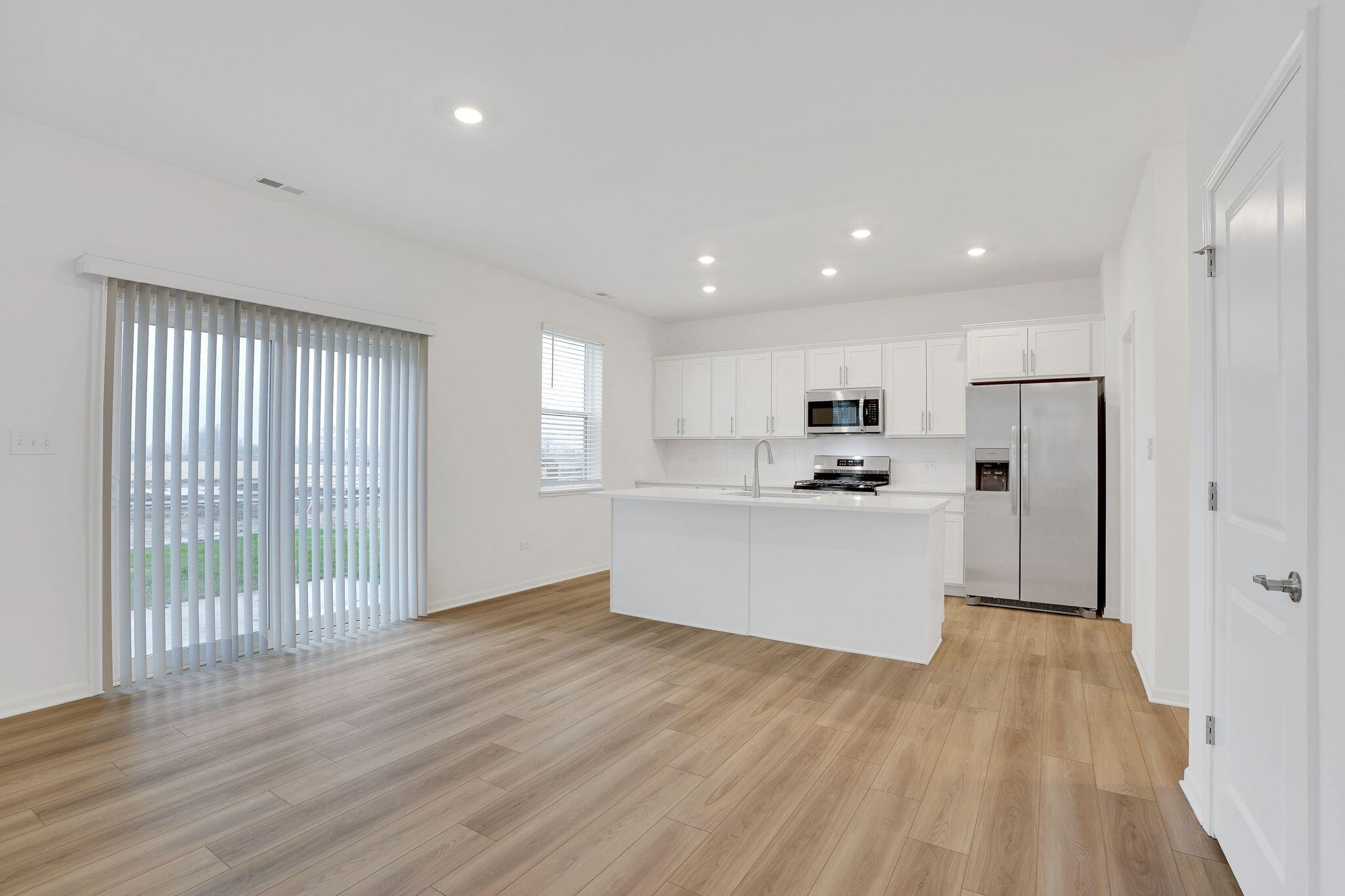 521 East 127th Place Crown Point, IN 46307 - Photo 10 of 37 a view of kitchen with wooden floor and electronic appliances