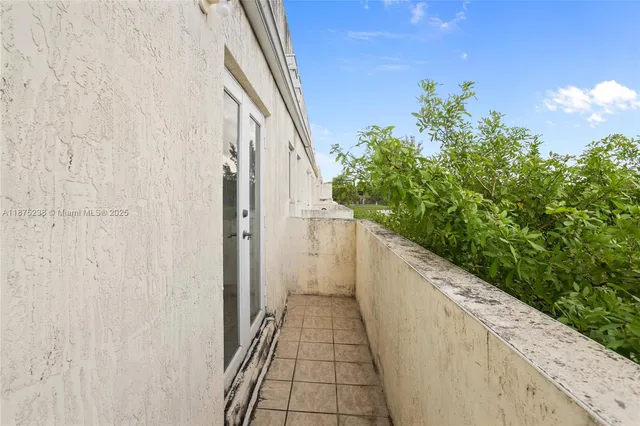 a view of a pathway both side of house