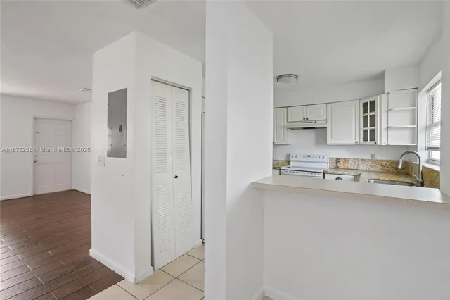 a kitchen with stainless steel appliances cabinets a sink and a counter top space