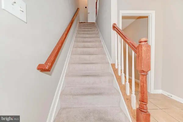 a view of staircase with white walls