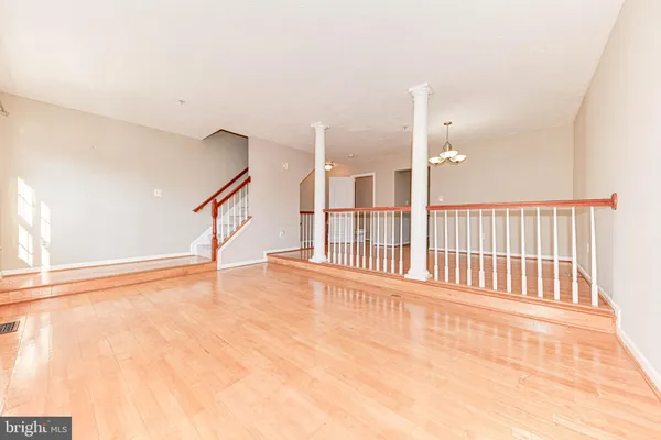 a view of an empty room with stairs