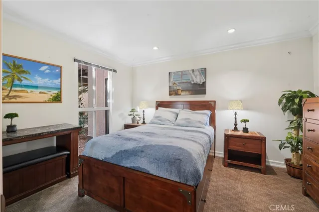 a bedroom with a bed and a cabinets