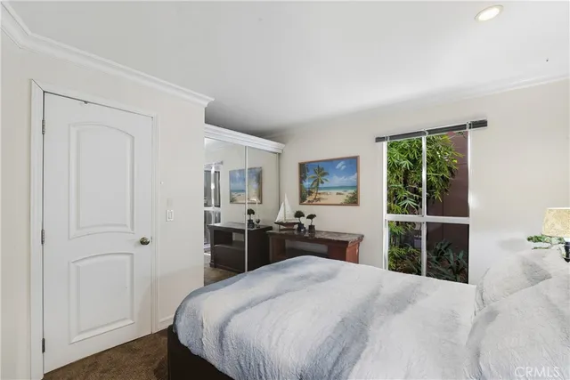 a laptop computer sitting on top of a table and a flat screen tv