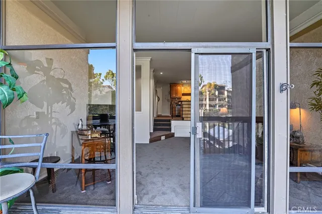 a view of a balcony with furniture