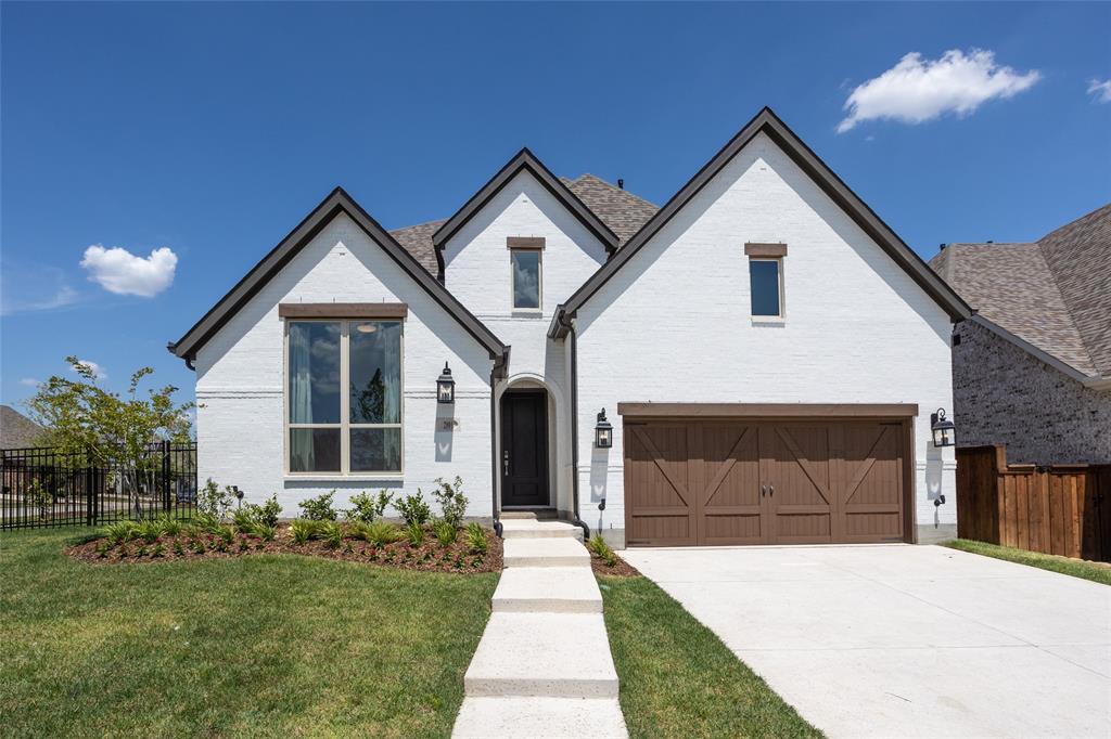 2001 Roundtree Circle East Aledo, TX 76008 - Photo 1 of 1 a front view of a house with a yard and garage
