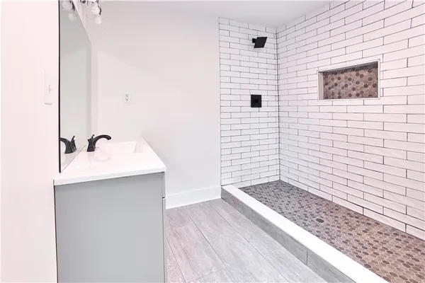 a bathroom with a sink and a mirror