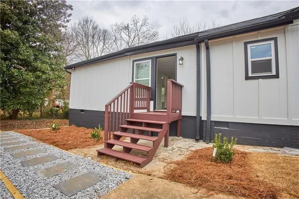 a front view of house with outdoor space