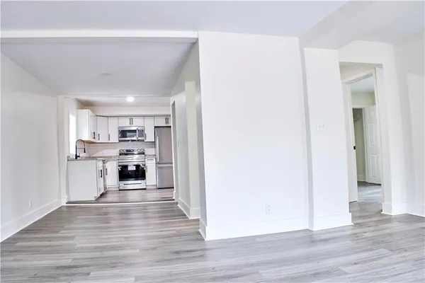 a view of kitchen with wooden floor