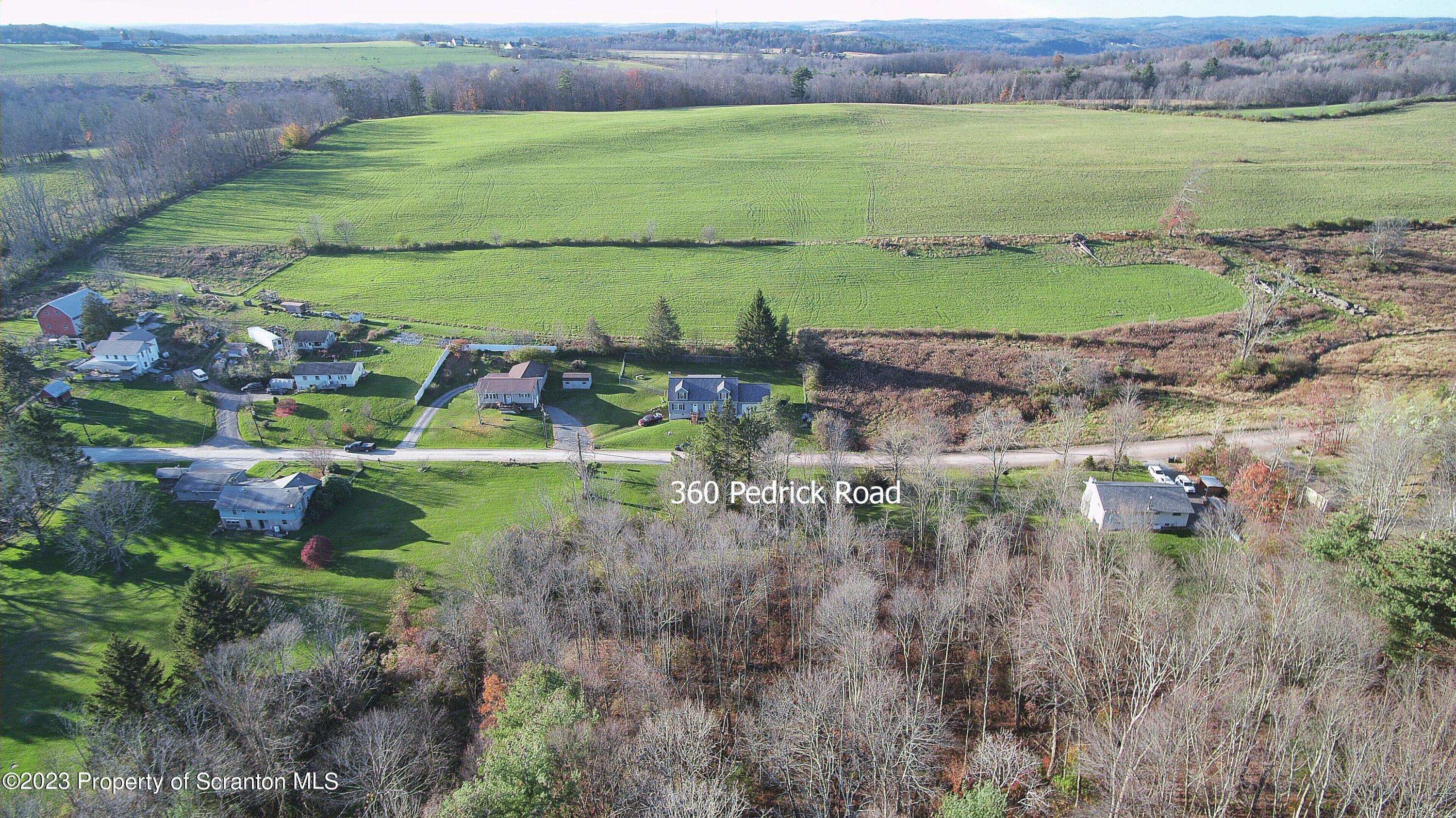 360 Pedrick Road Nicholson, PA 18446 - Photo 3 of 8 a view of a lake with a big yard