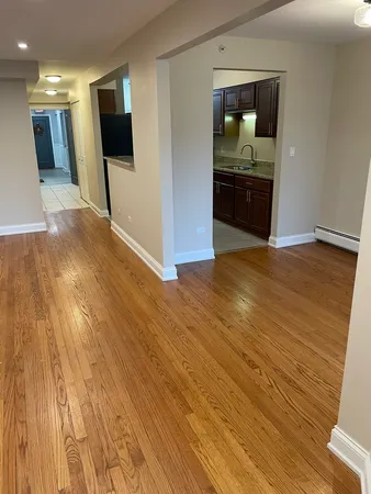 a view of a livingroom with wooden floor
