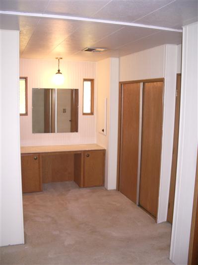 67 Cardinal Way, Unit 24 Santa Rosa, CA 95409 - Photo 10 of 11 a bathroom with a double vanity sink and mirror