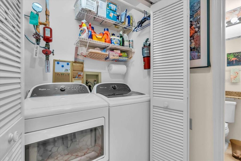 6713 Stone River Road, Unit 206 Bradenton, FL 34203 - Photo 20 of 58 a utility room with dryer and washer